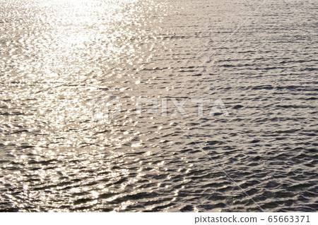 The sea shining in the sun at dusk / Okinawa Prefecture The sea shining in the sun at dusk / Okinawa Prefecture 65663371