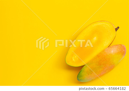 Tropical fruit, Mango on yellow background. Tropical fruit, Mango on yellow background. 65664182