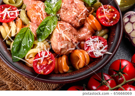 Delicious fresh pasta with meatballs 65666069