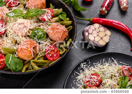 Delicious fresh pasta with meatballs 65666088