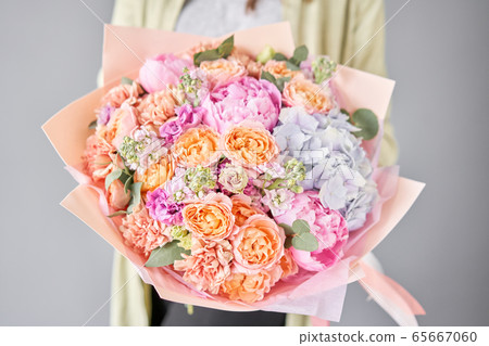 Pink peonies and hydrangea. Beautiful bouquet of mixed flowers in woman hand. Floral shop concept . Handsome fresh bouquet. Flowers delivery. Pink peonies and hydrangea. Beautiful bouquet of mixed flowers in woman hand. Floral shop concept . Handsome fresh bouquet. Flowers delivery. 65667060