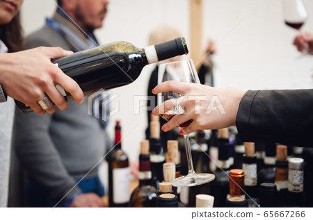 Tasting experience with a female sommelier serving Tasting experience with a female sommelier serving 65667266