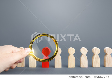 Men with a magnifying glass studies a red person in a people row. Identification, examination and isolation of potential carrier of dangerous infections Prevent diseases spread. Asymptomatic disease 65667783