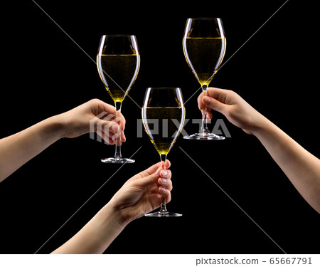 Set of hands holding white wine glass isolated on Set of hands holding white wine glass isolated on 65667791