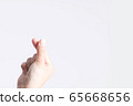 A hand symbol from a fingertip to be Love signs in Korean style called mini heart or little heart. 65668656