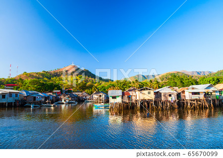 Stilt houses raised piles over water 65670099