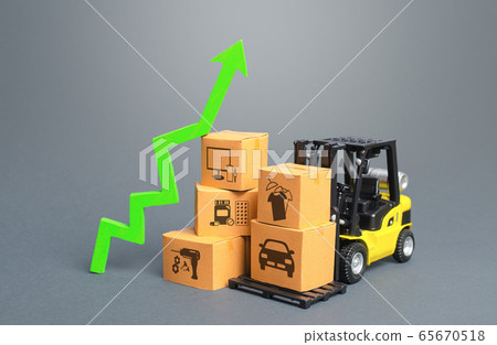 Forklift with boxes and green arrow up. Economic recovery and increased trade and freight traffic. Increasing the cost of transport services tariffs because of special quarantine measures at borders. Forklift with boxes and green arrow up. Economic recovery and increased trade and freight traffic. Increasing the cost of transport services tariffs because of special quarantine measures at borders. 65670518