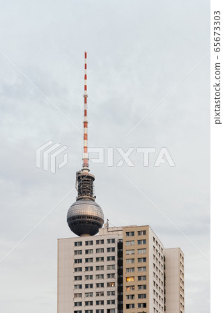 Television tower against blue sky with clouds in Berlin Television tower against blue sky with clouds in Berlin 65673303