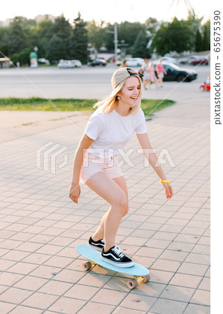charming and cheerfull girl longboarding charming and cheerfull girl longboarding 65675390
