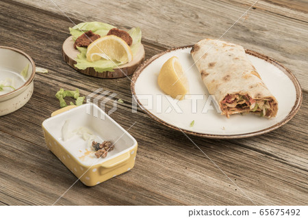 left overs of Turkish kebabs on wooden table 65675492