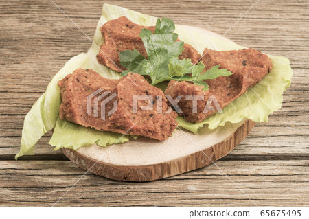Turkish appetizer made of raw minced meat and Turkish appetizer made of raw minced meat and 65675495