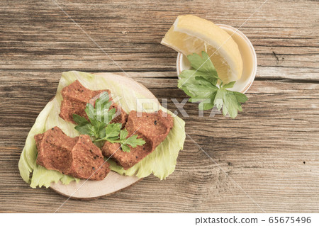 Turkish appetizer made of raw minced meat and Turkish appetizer made of raw minced meat and 65675496
