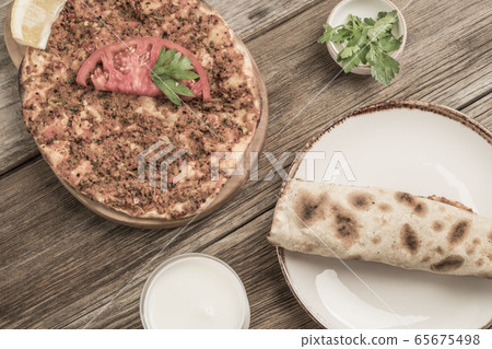 Turkish pizza, made of ground beef and onion 65675498