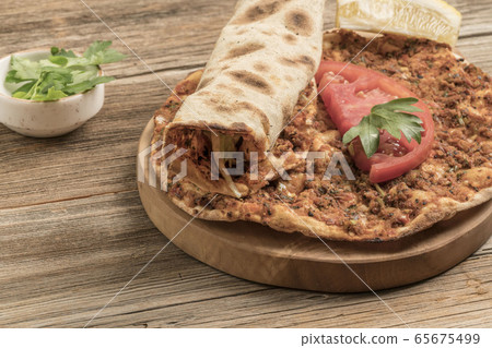 Turkish pizza, made of ground beef and onion Turkish pizza, made of ground beef and onion 65675499