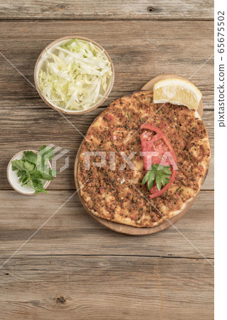 Turkish pizza, made of ground beef and onion Turkish pizza, made of ground beef and onion 65675502