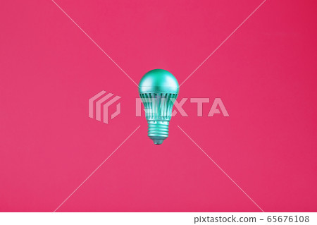 The light bulb hovers in the center of the frame The light bulb hovers in the center of the frame 65676108
