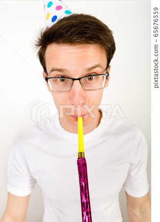 A vertical studio shot of a guy wearing glasses 65676559