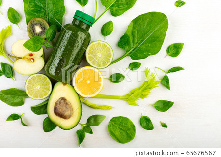 A creative picture of bottle filled with green beverage A creative picture of bottle filled with green beverage 65676567