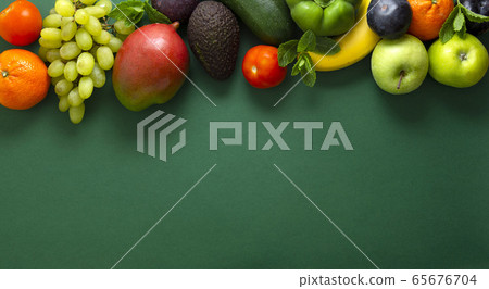 Fresh fruits and vegetables over green background, Fresh fruits and vegetables over green background, 65676704