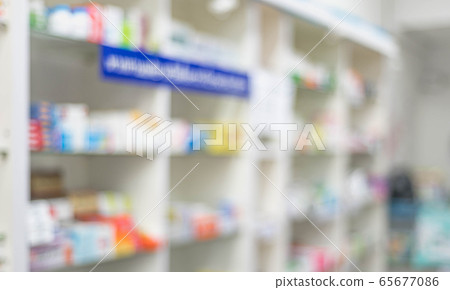 Pharmacy interior and medicine shelf and Pharmacy cabinets with medicines and drugs tablets at  drug store for protect body with blurred background. 65677086