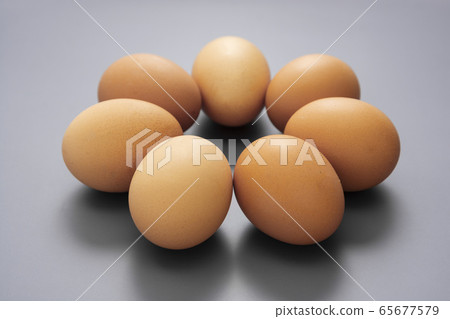 Raw eggs isolated on grey background, protein Raw eggs isolated on grey background, protein 65677579