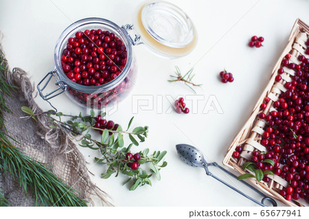 autumn berries on table, lingonberry raw closeup autumn berries on table, lingonberry raw closeup 65677941