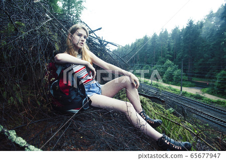 young pretty tourist girl with backpack in forest, travel lifestyle people concept young pretty tourist girl with backpack in forest, travel lifestyle people concept 65677947