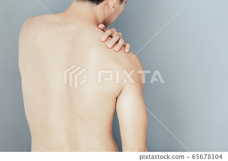 Closeup man hand holding shoulder with pain  Closeup man hand holding shoulder with pain  65678104