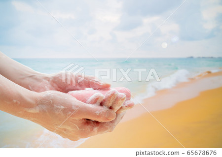 Antibacterial soap in the hands. Hand disinfection with soap. Antibacterial soap in the hands. Hand disinfection with soap. 65678676