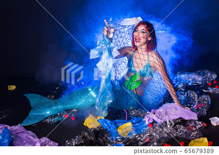 Ocean plastic pollution concept. Mermaid lives to polluted habitat. 65679389