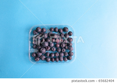 Plastic container with fresh raw organic ripe Plastic container with fresh raw organic ripe 65682404
