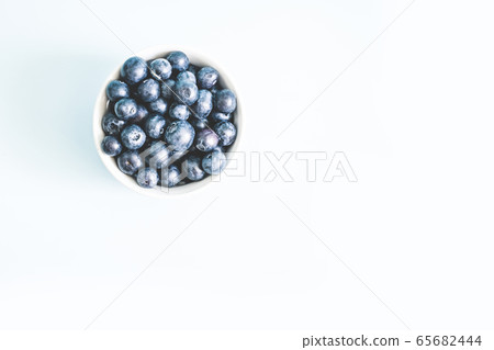 Fresh raw organic blueberry in mug with copy space 65682444