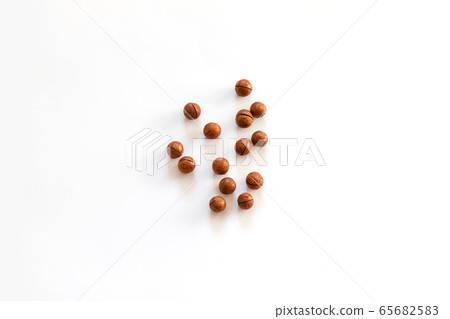 Top view of Macadamia nuts and space for text on Top view of Macadamia nuts and space for text on 65682583