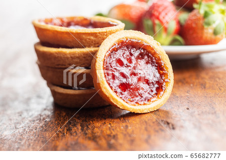 Sweet biscuits with strawberries jam Sweet biscuits with strawberries jam 65682777