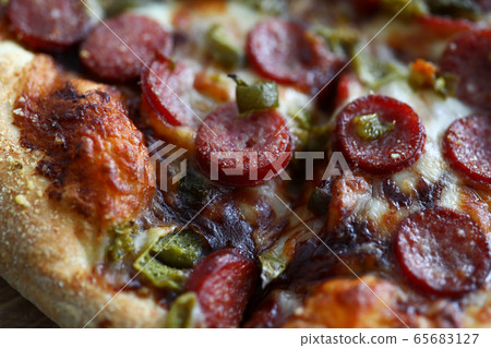 Fresh baked pizza with crusty cheese and hot tasty pepperoni Fresh baked pizza with crusty cheese and hot tasty pepperoni 65683127