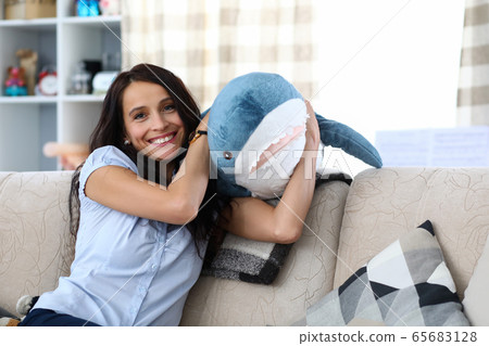 Woman holding toy shark Woman holding toy shark 65683128