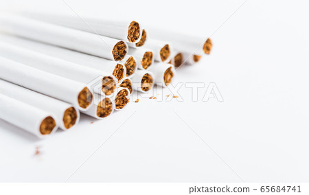 stack pile cigarette or tobacco on white stack pile cigarette or tobacco on white 65684741