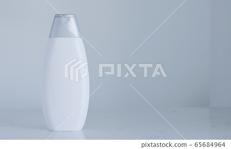 Blank label cosmetic container bottle as product mockup on gray background 65684964