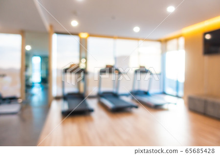 Abstract blur gym room interior with fitness equipment Abstract blur gym room interior with fitness equipment 65685428
