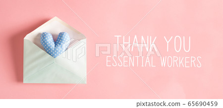 Thank You Essential Workers message with a heart cushion in an envelope 65690459