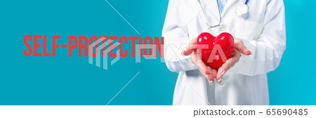 Self-protection theme with a doctor holding a heart Self-protection theme with a doctor holding a heart 65690485