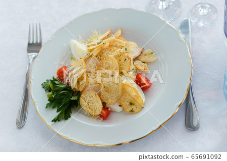 Snack in the restaurant. Salad before the main 65691092