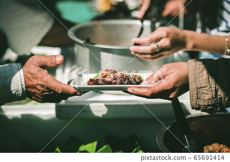 Feeding the poor to hands of a beggar, Poverty Feeding the poor to hands of a beggar, Poverty 65691414
