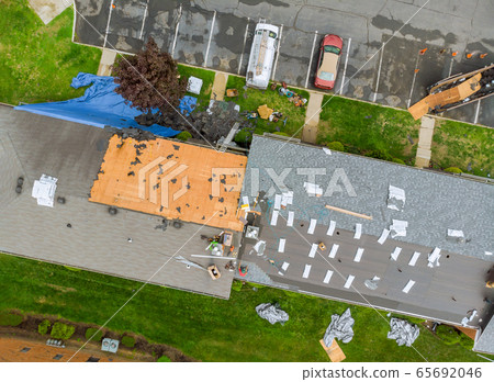 Demolition removal of an old asphalt shingle roof Demolition removal of an old asphalt shingle roof 65692046