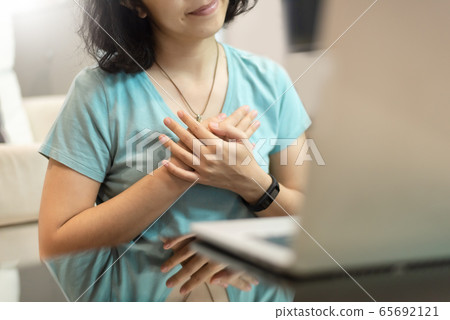 Young woman in blue shirt with sincere smile Young woman in blue shirt with sincere smile 65692121
