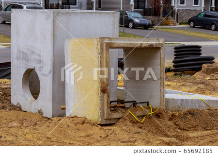 The square concrete blocks with hole in the The square concrete blocks with hole in the 65692185