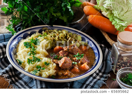 Traditional irish stew served with potatoes and Traditional irish stew served with potatoes and 65695662