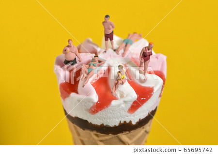 Ice Cream In Waffle Cone and Miniature People Ice Cream In Waffle Cone and Miniature People 65695742