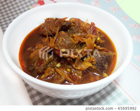 Hunglae pork curry in white bowl Hunglae pork curry in white bowl 65695992