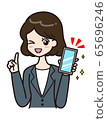 Woman smartphone pose in suit 65696246